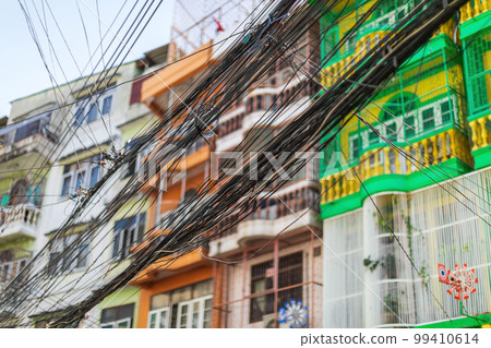 Intertwined electric wires in front of buildings which is the first priority problem to solve in Bangkok. Intertwined electric wires in front of buildings which is the first priority problem to solve in Bangkok. 99410614