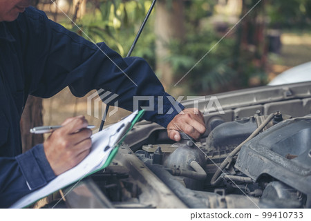 Mechanic car service auto garage in automotive mobile center. Technician workshop repair engine motor vehicles service mechanical engineering business. Automobile mechanic hands car repairs technic Mechanic car service auto garage in automotive mobile center. Technician workshop repair engine motor vehicles service mechanical engineering business. Automobile mechanic hands car repairs technic 99410733