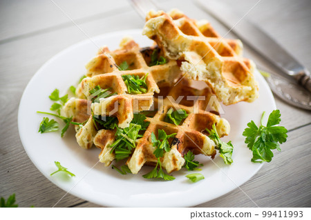 fried Belgian vegetable waffles with spices and herbs 99411993