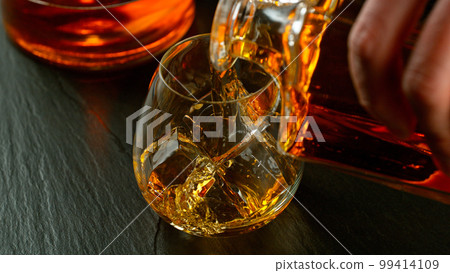 Fresh various cocktails on the bar, dark toned background 99414109