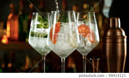 Fresh various cocktails on the bar, dark toned background 99414121