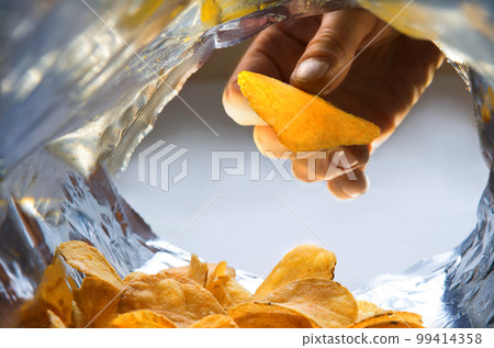 Potato chips. View from inside the package Potato chips. View from inside the package 99414358