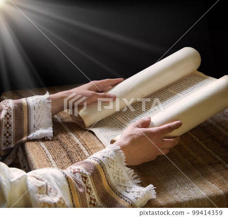 Hands hold an old scroll Hands hold an old scroll 99414359