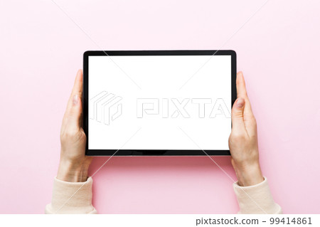 female teen hands using tablet pc with white screen, Mockup image of woman hand holding white tablet pc with blank white screen at home 99414861