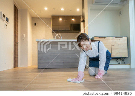 Housekeeper, housekeeping agent, young woman mopping the floor Housekeeper, housekeeping agent, young woman mopping the floor 99414920