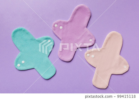 Eco-friendly reusable fabric women's pads. set of colorful bright reusable menstrual pads. zero waste woman periods concept top view with copy space 99415118