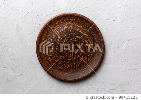 Top view of empty plate on cement background. Empty space for your design Top view of empty plate on cement background. Empty space for your design 99415123