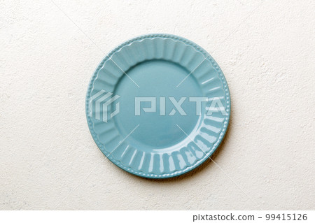 Top view of empty grey plate on cement background. Empty space for your design Top view of empty grey plate on cement background. Empty space for your design 99415126