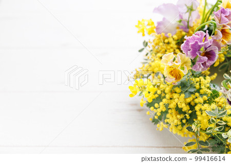 Springtime mimosa and pansy wreath Springtime mimosa and pansy wreath 99416614