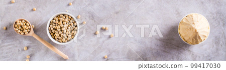 Traditional fermented soy miso seasoning in a bowl on the table. Japanese food. Top view. Web banner Traditional fermented soy miso seasoning in a bowl on the table. Japanese food. Top view. Web banner 99417030