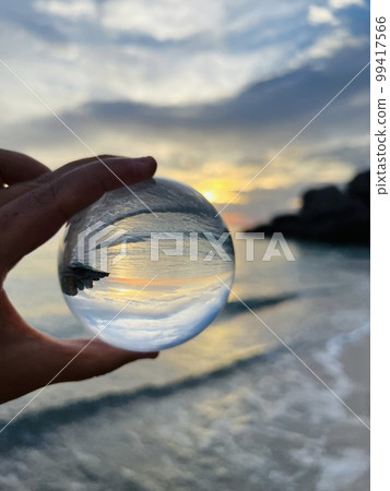 Beautiful scenic view through lens of crystal ball at summer sunset. Beautiful scenic view through lens of crystal ball at summer sunset. 99417566