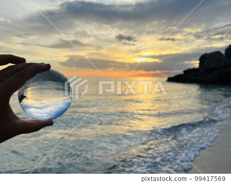 Beautiful scenic view through lens of crystal ball at summer sunset. Beautiful scenic view through lens of crystal ball at summer sunset. 99417569