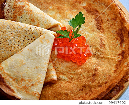 Pancakes with red caviar, cooked for Maslenitsa Pancakes with red caviar, cooked for Maslenitsa 99417602