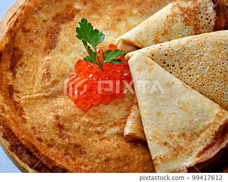 Pancakes with red caviar, cooked for Maslenitsa 99417612