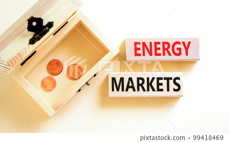 Energy markets symbol. Concept words Energy markets on wooden block. Beautiful white table white background. Beautiful wooden chest with coins. Business energy markets concept. Copy space. Energy markets symbol. Concept words Energy markets on wooden block. Beautiful white table white background. Beautiful wooden chest with coins. Business energy markets concept. Copy space. 99418469