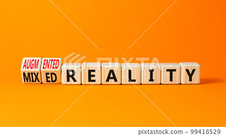 Augmented or mixed reality symbol. Concept words Augmented reality Mixed reality on wooden cubes. Beautiful orange table orange background. Business augmented or mixed reality concept. Copy space. 99418529