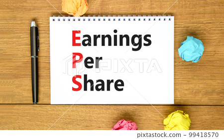 EPS earnings per share symbol. Concept words EPS earnings per share on white note on a beautiful wooden background. Business and EPS earnings per share concept. Copy space. EPS earnings per share symbol. Concept words EPS earnings per share on white note on a beautiful wooden background. Business and EPS earnings per share concept. Copy space. 99418570