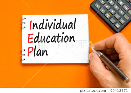 IEP individual education plan symbol. Concept words IEP individual education plan on white note on a beautiful orange background. Business IEP individual education plan concept. Copy space. 99418571