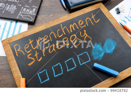 Small blackboard with retrenchment strategy inscription and papers. 99418782