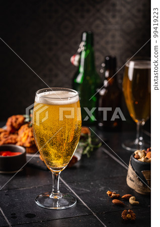 Glass of light beer Glass of light beer 99419223