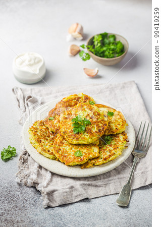 Green zucchini pancakes Green zucchini pancakes 99419259