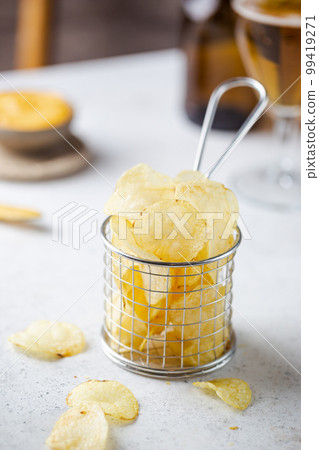 Crunchy delicious potato chips Crunchy delicious potato chips 99419271