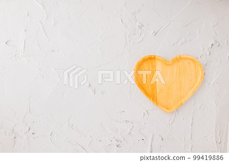 Empty heart shape wooden tray isolated on white cement background, top view, flat lay, dish plate or bowl wood for food, Collection, happy valentine day 99419886