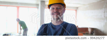 Portrait of confident smiling male architect foreman at construction site Portrait of confident smiling male architect foreman at construction site 99420277