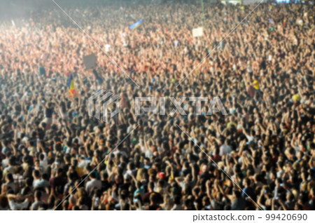 Blurred crowd of people partying 99420690