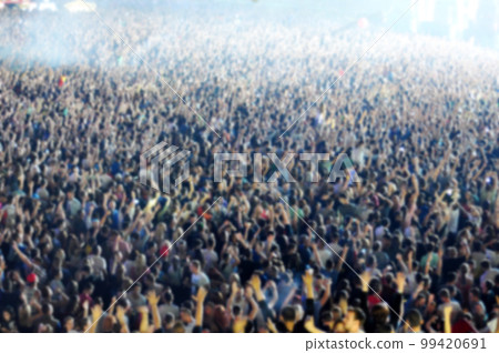 Blurred crowd of people partying Blurred crowd of people partying 99420691