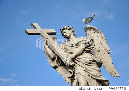 Statue of an Angel with the Cross 99420718