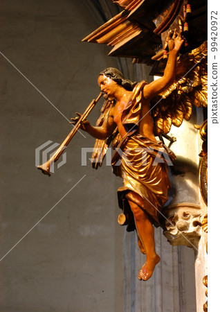 Wooden statue in a catholic church 99420972