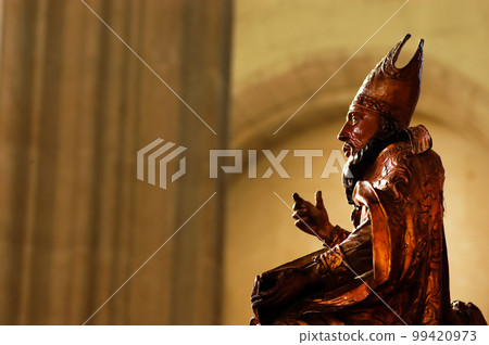 Wooden statue in a catholic church 99420973