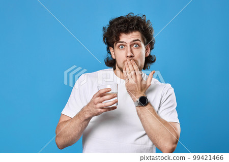 handsome man with drinking glass of water 99421466
