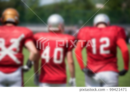 Blurred American football players 99421471
