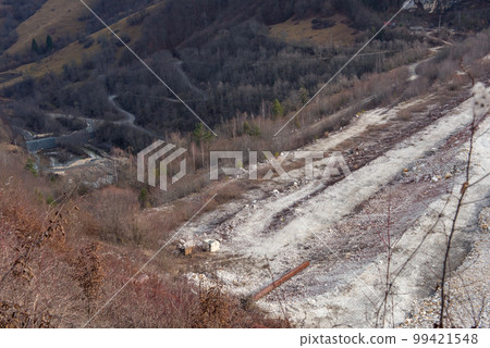 Barrier stopping the flow of copper and gold mining mining residuals into a settling basin, decantation lake 99421548