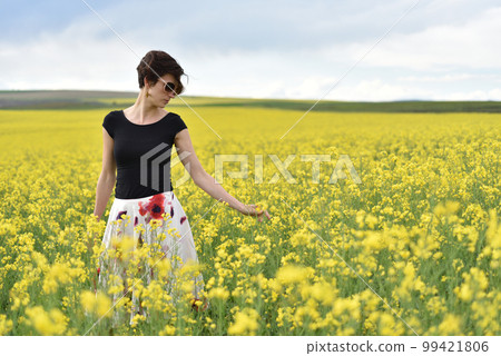 Young woman enjoying freedom in the outdoors 99421806