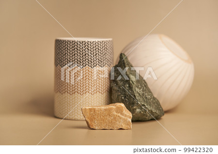 A podium made of natural stone and porcelain on a light background for an empty exhibition for the presentation of your product. Background for cosmetic products, with space to copy.High quality photo A podium made of natural stone and porcelain on a light background for an empty exhibition for the presentation of your product. Background for cosmetic products, with space to copy.High quality photo 99422320