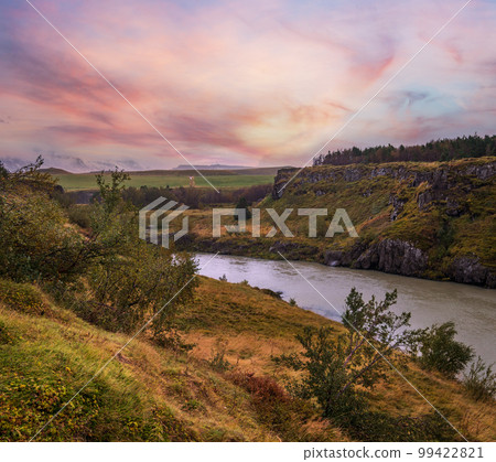 Hrutey island public park near Blonduos town, North-West of Iceland. View during auto trip by Ring Road. Spectacular Icelandic landscape with scenic autumn nature and Blanda river with cataracts. 99422821