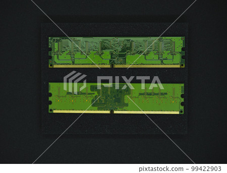 Green RAM strips on black foam. Computer chips close-up. Microchips and memory chips. Green RAM strips on black foam. Computer chips close-up. Microchips and memory chips. 99422903