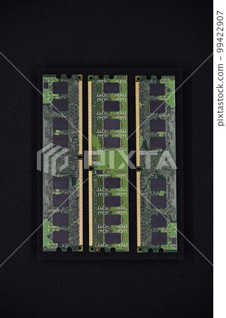 Green RAM strips on black foam. Computer chips close-up. Microchips and memory chips. Green RAM strips on black foam. Computer chips close-up. Microchips and memory chips. 99422907
