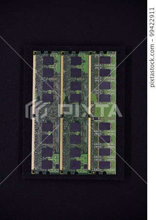 Green RAM strips on black foam. Computer chips close-up. Microchips and memory chips. 99422911