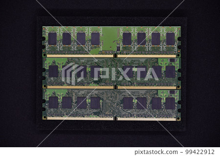 Green RAM strips on black foam. Computer chips close-up. Microchips and memory chips. Green RAM strips on black foam. Computer chips close-up. Microchips and memory chips. 99422912