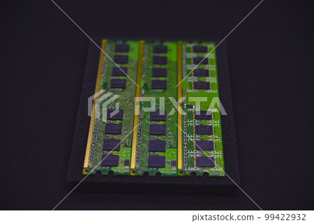 Green RAM strips on black foam. Computer chips close-up. Microchips and memory chips. Green RAM strips on black foam. Computer chips close-up. Microchips and memory chips. 99422932
