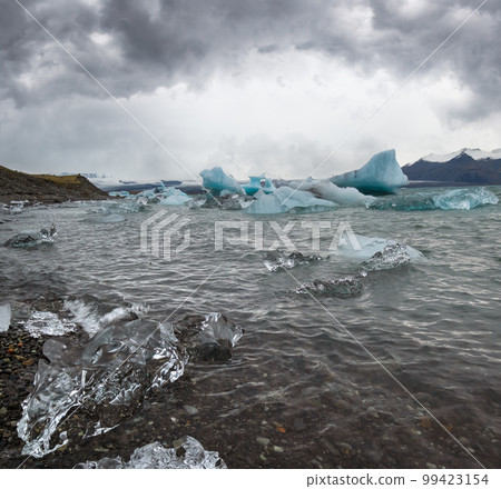 Jokulsarlon glacial lake, lagoon with ice blocks, Iceland. Situated near the edge of the Atlantic Ocean at the head of the Breidamerkurjokull glacier, Vatnajokull icecap or Vatna Glacier. Jokulsarlon glacial lake, lagoon with ice blocks, Iceland. Situated near the edge of the Atlantic Ocean at the head of the Breidamerkurjokull glacier, Vatnajokull icecap or Vatna Glacier. 99423154