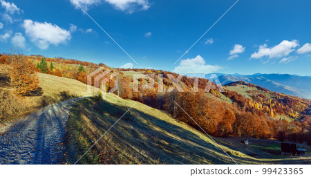 Rural road in autumn in mountain. Rural road in autumn in mountain. 99423365