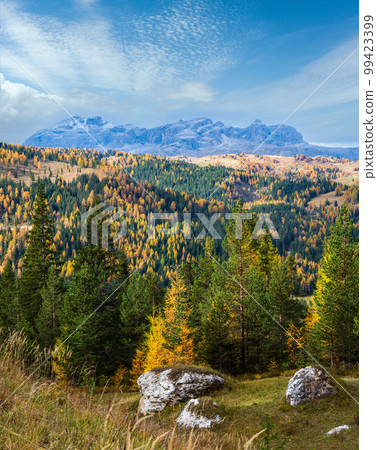 Overcast morning autumn alpine Dolomites mountain scene. Peaceful view near Valparola Pass, Belluno, Italy. 99423399