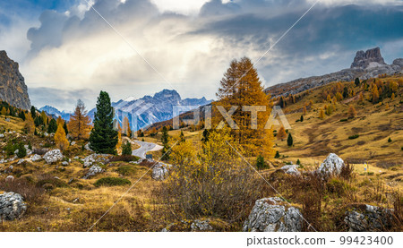 Overcast morning autumn alpine Dolomites mountain scene. Peaceful view near Valparola and Falzarego Path, Belluno, Italy. Overcast morning autumn alpine Dolomites mountain scene. Peaceful view near Valparola and Falzarego Path, Belluno, Italy. 99423400
