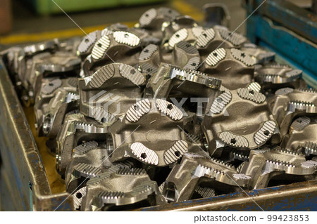 The freshly prepared parts of the driveshaft of the truck are stacked in a box The freshly prepared parts of the driveshaft of the truck are stacked in a box 99423853