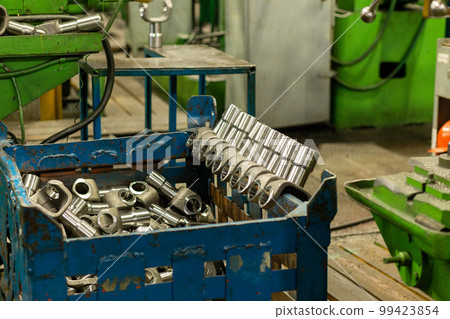 Cardan shafts and gimbal transmissions laying in box during production process. 99423854